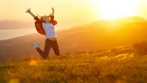 WOMAN JUMPING WITH JOY FOR WEIGHT LOSS