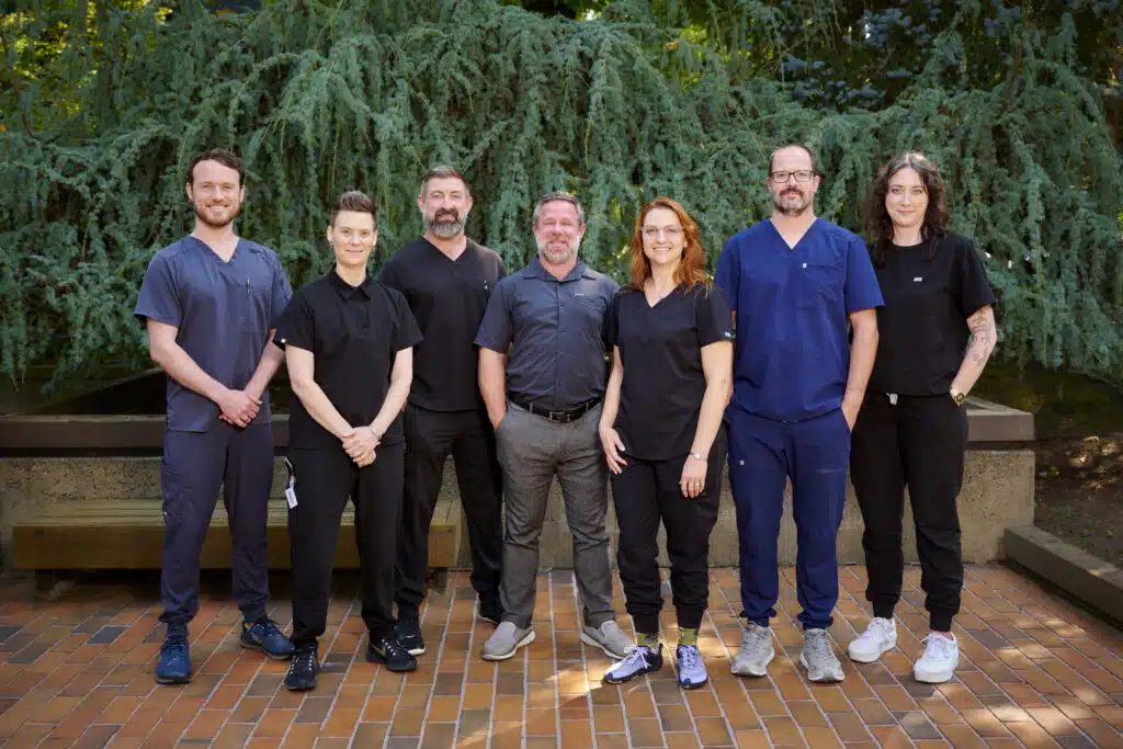 Dr. Robert Strait with the Full Potential HRT Clinic Tigard medical team standing outside the clinic in Portland Metro.